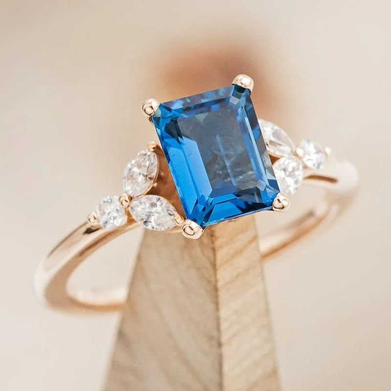 "BLOSSOM" - EMERALD CUT BLUE TOPAZ ENGAGEMENT RING WITH DIAMOND ACCENTS