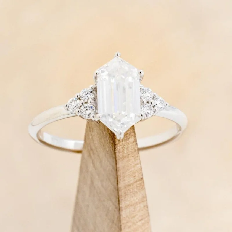 "OCTAVIA" - ELONGATED HEXAGON CUT MOISSANITE ENGAGEMENT RING WITH DIAMOND ACCENTS