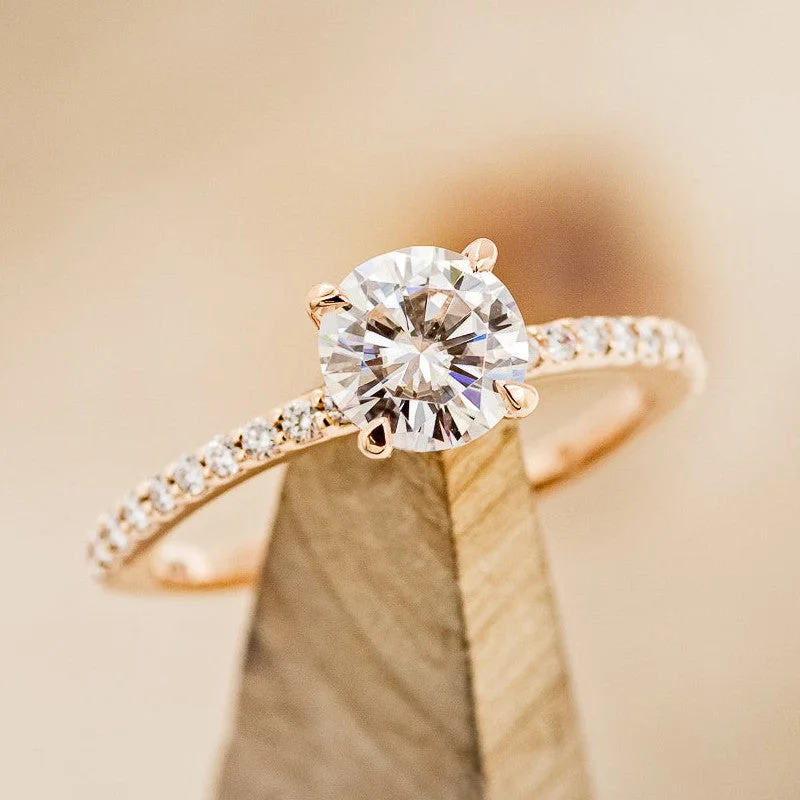 "RAMONA" - 4 PRONG ROUND CUT MOISSANITE ENGAGEMENT RING WITH DIAMOND ACCENTS